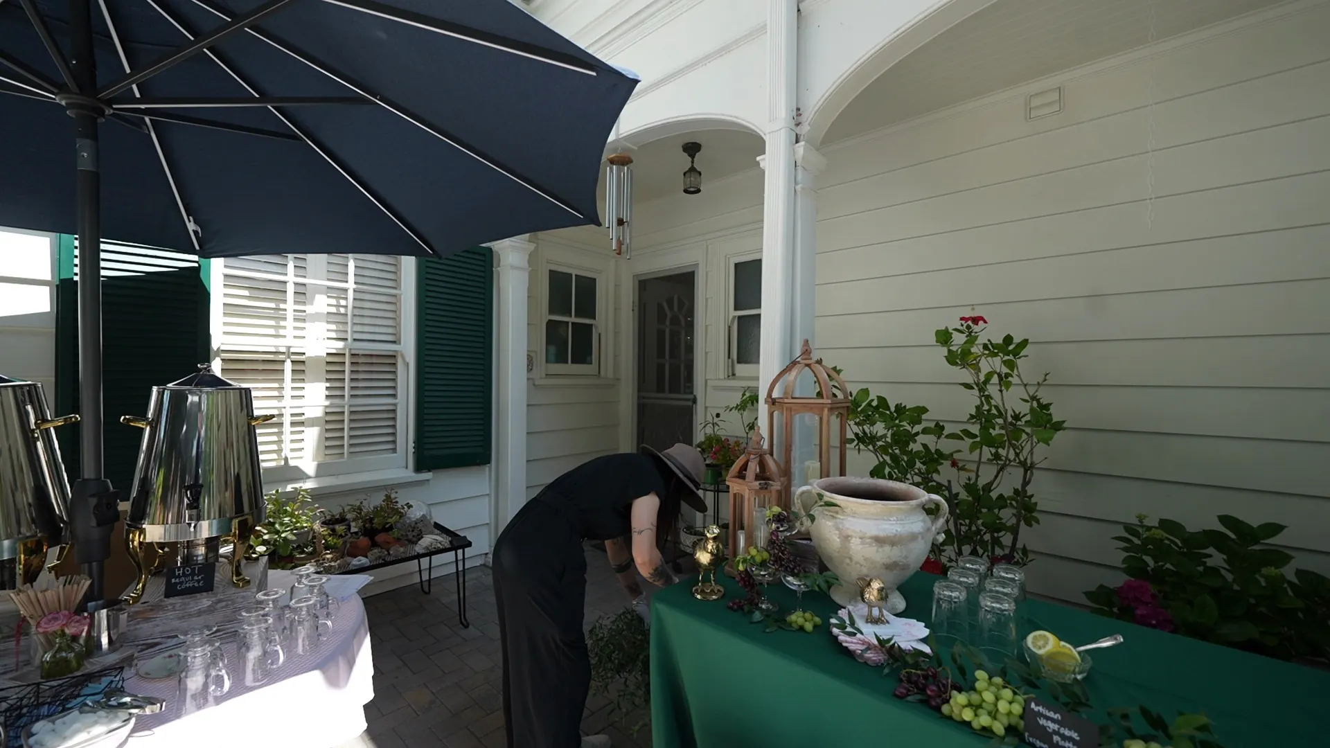 Umbrella tables arranged along a home's patio at a Mill Valley backyard dinner