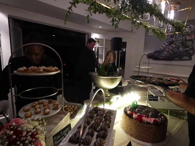 Tiered dessert stands loaded with berries and pastries at a Corte Madera family celebration