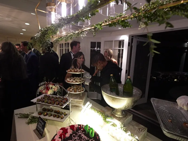 Bar table with wine chillers and glasses beside the house at a Corte Madera shower