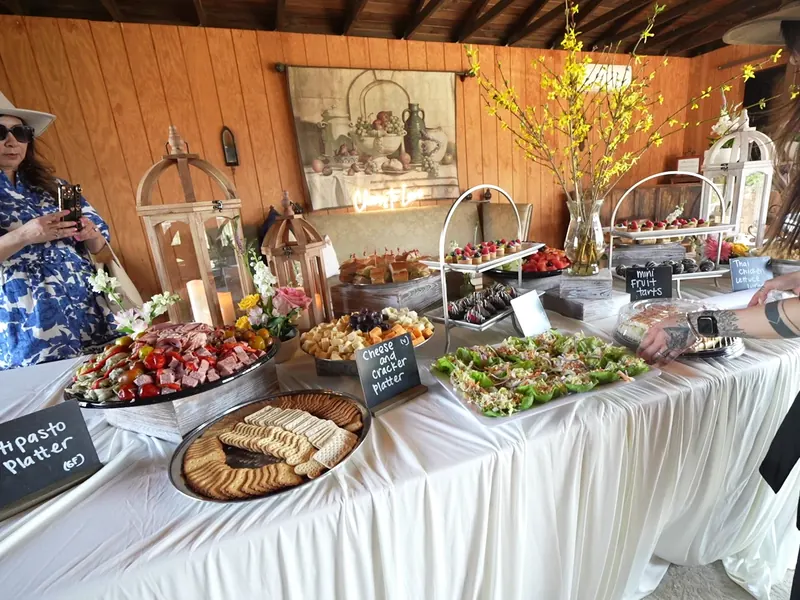 Guest served desserts by an attendant during cocktail hour at a Marin County garden party
