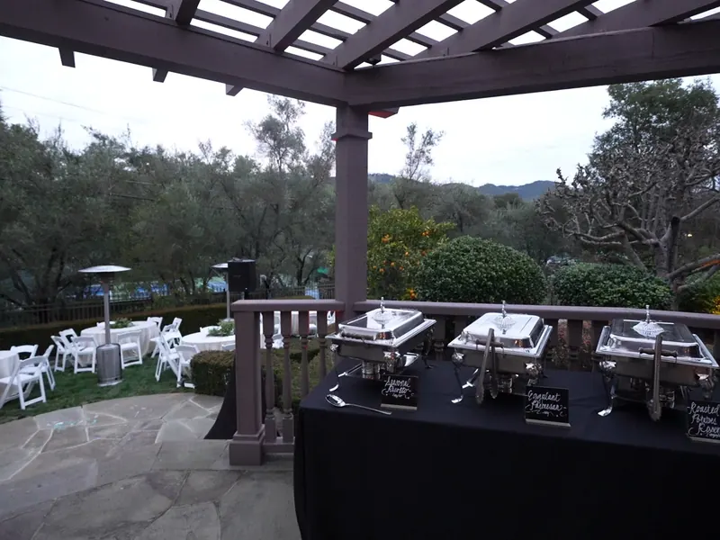 Hillside patio buffet with chafing dishes ready to serve at a Tiburon waterfront event