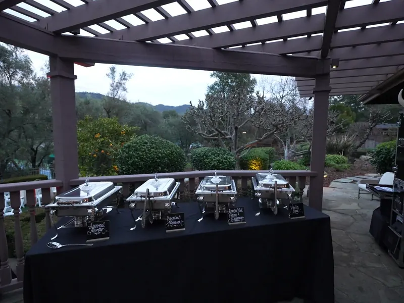 Pergola-covered patio buffet overlooking the hills at a Rohnert Park birthday dinner