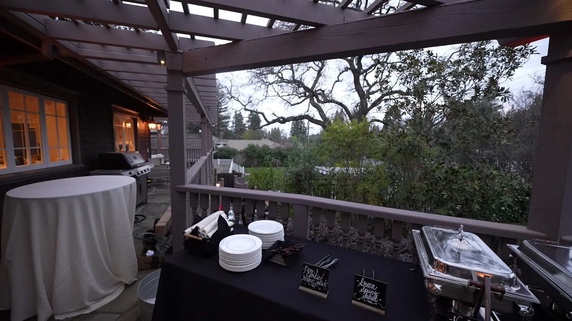 Pergola buffet with a water view beyond the deck at a Tiburon bayfront reception
