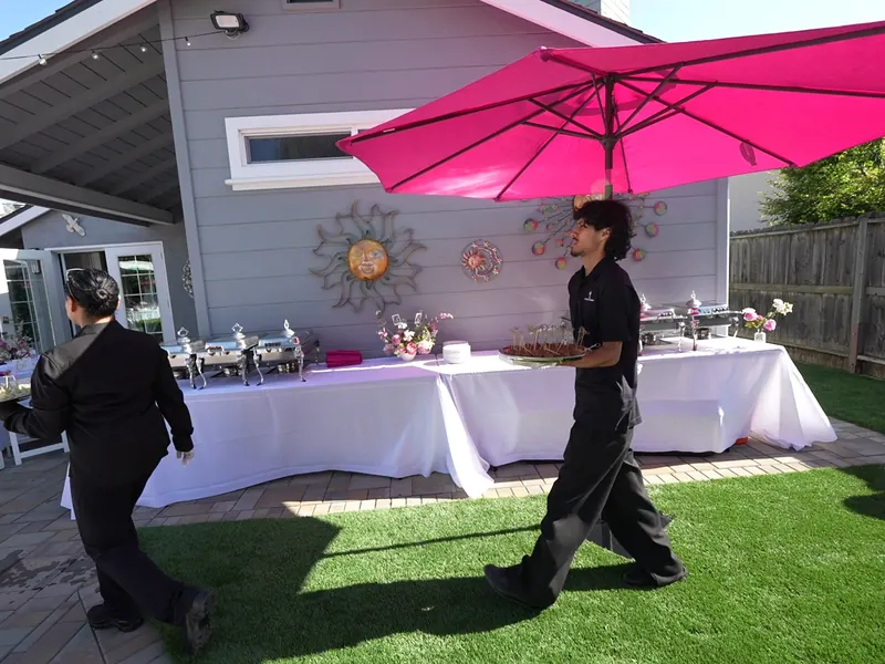 Guests mingling around an indoor dessert bar at a Sausalito hillside reception